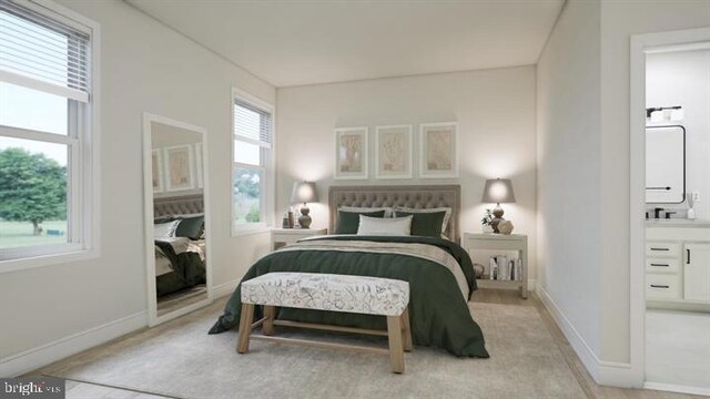 bedroom featuring connected bathroom and baseboards