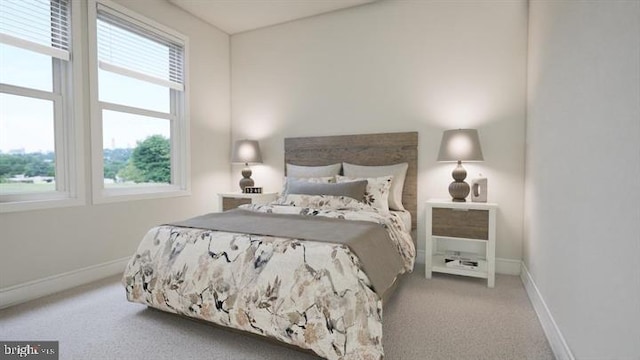 carpeted bedroom featuring baseboards