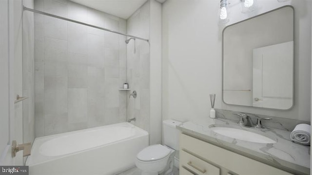 bathroom with vanity, toilet, and bathing tub / shower combination