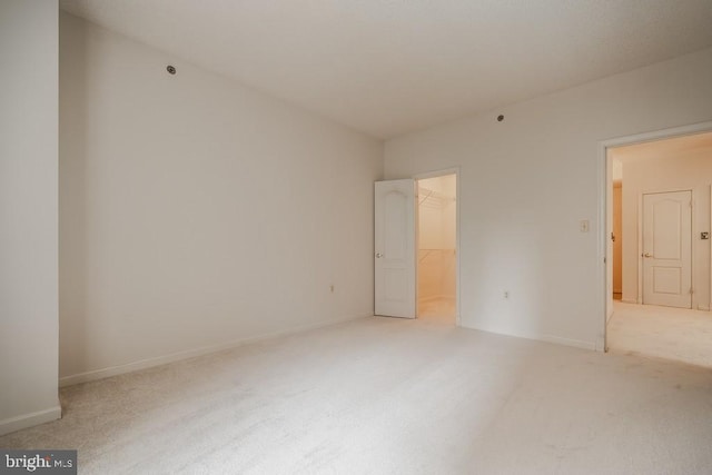 1211 S Eads St S Unit 401, Arlington, VA 22202 - spare room featuring light carpet and baseboards