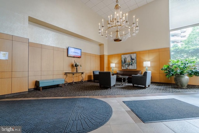 1211 S Eads St S Unit 401, Arlington, VA 22202 - building lobby featuring a towering ceiling, a decorative wall, and wainscoting
