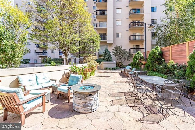 1211 S Eads St S Unit 401, Arlington, VA 22202 - view of patio with an outdoor living space with a fire pit