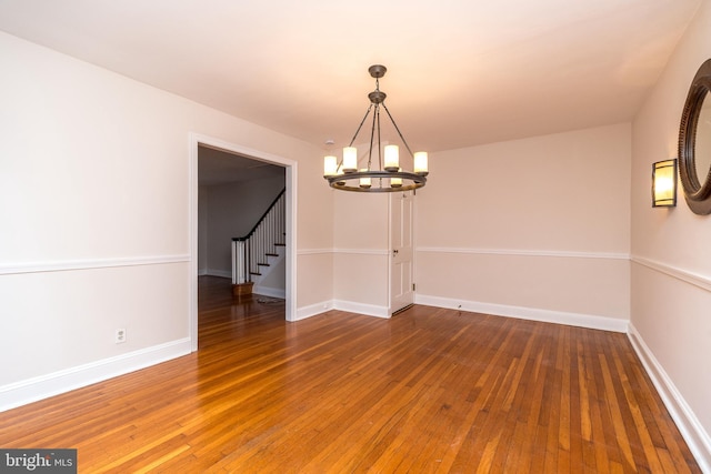 2948 Normandy Rd, Ardmore, PA 19003 - spare room with a chandelier, hardwood / wood-style floors, stairs, and baseboards
