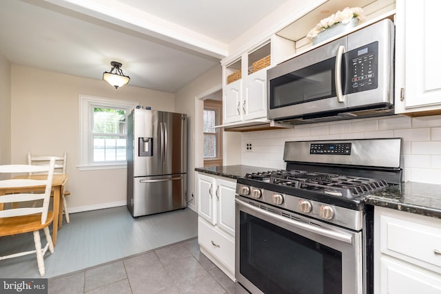 2948 Normandy Rd, Ardmore, PA 19003 - kitchen featuring stainless steel appliances, tasteful backsplash, white cabinetry, and dark stone countertops