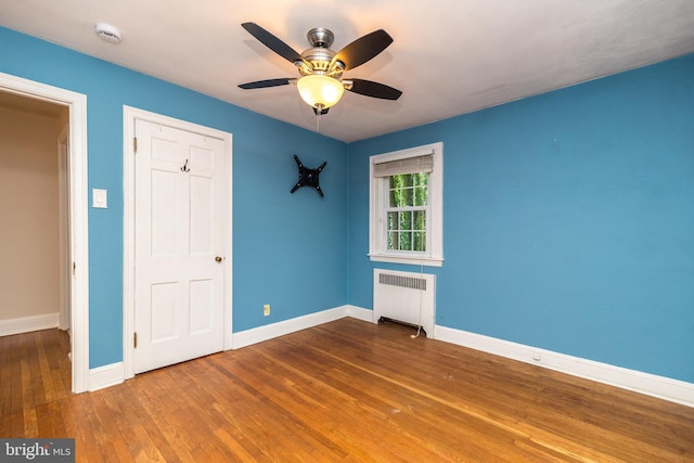 2948 Normandy Rd, Ardmore, PA 19003 - unfurnished bedroom featuring radiator heating unit, hardwood / wood-style floors, baseboards, and ceiling fan