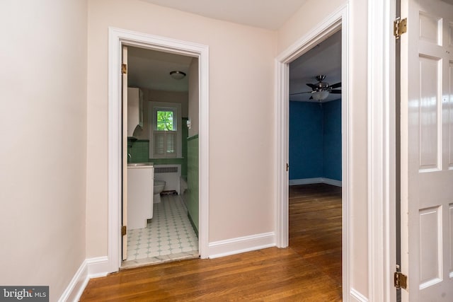 2948 Normandy Rd, Ardmore, PA 19003 - hall with radiator, wood finished floors, and baseboards