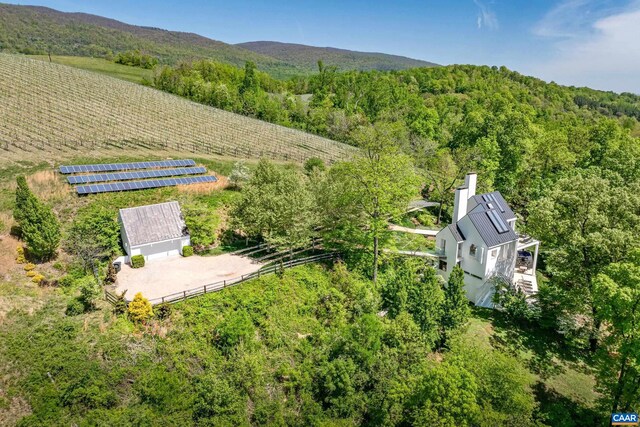 drone / aerial view with a forest view and a rural view