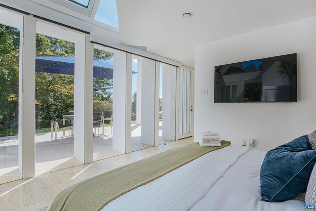 bedroom featuring access to outside and floor to ceiling windows
