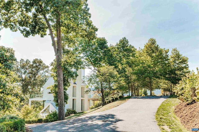 view of property's community with aphalt driveway