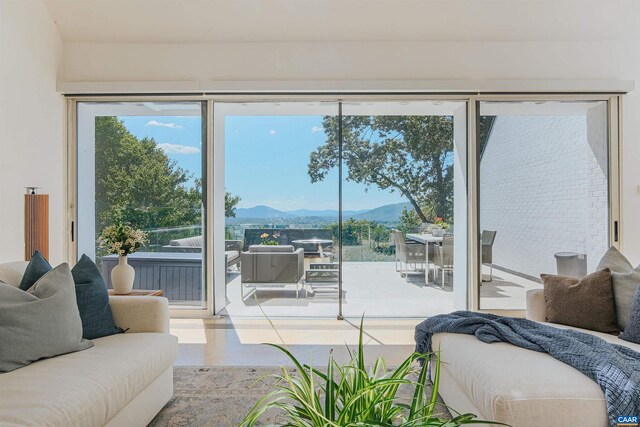 interior space with a mountain view and plenty of natural light