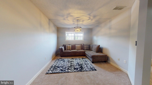 609 Quartzite Cir, Winchester, VA 22601 - living area featuring visible vents, carpet floors, baseboards, a textured ceiling, and a chandelier