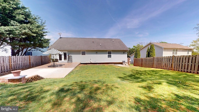 609 Quartzite Cir, Winchester, VA 22601 - rear view of property featuring a lawn, a fenced backyard, and a patio area