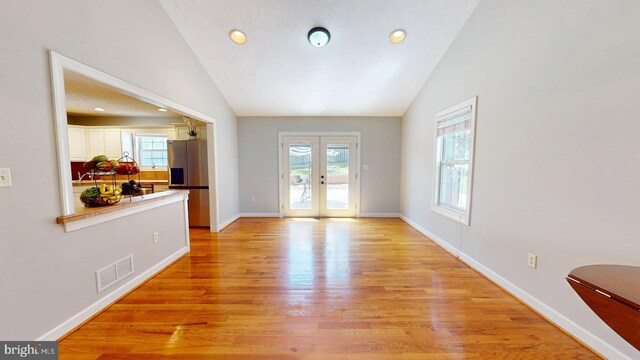 609 Quartzite Cir, Winchester, VA 22601 - interior space with light wood finished floors, french doors, baseboards, lofted ceiling, and visible vents