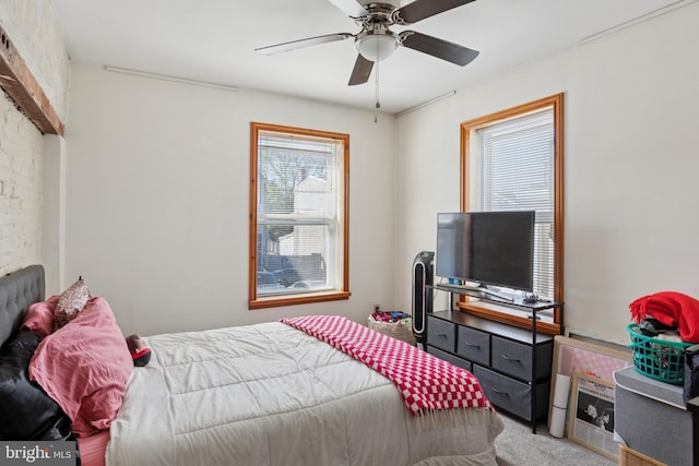 carpeted bedroom with a ceiling fan