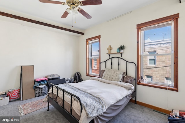 carpeted bedroom with ceiling fan
