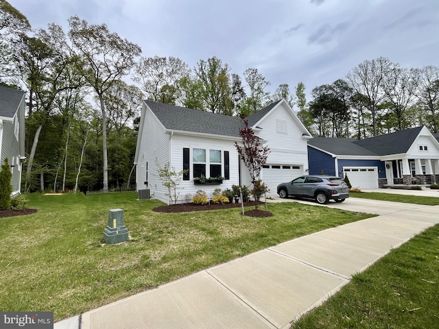 view of front of property with roof with shingles, a garage, a front yard, central AC unit, and driveway