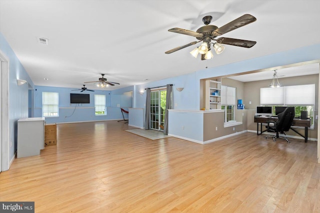 living room featuring visible vents, light wood finished floors, ceiling fan, and baseboards