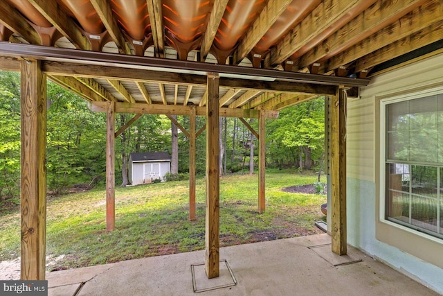 view of patio / terrace featuring a shed and an outbuilding