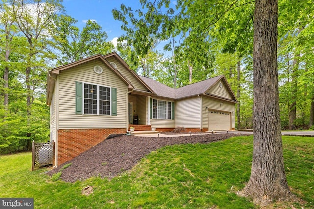 ranch-style house featuring an attached garage, driveway, and a front lawn