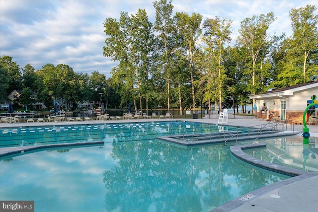 pool featuring a patio and fence