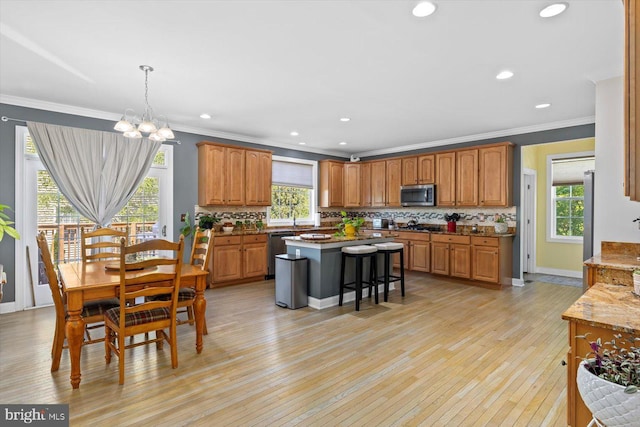 11 Garnet Way, Fredericksburg, VA 22405 - kitchen with crown molding, backsplash, appliances with stainless steel finishes, and light wood-style flooring