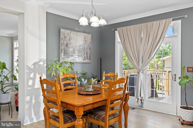 11 Garnet Way, Fredericksburg, VA 22405 - dining space featuring crown molding, baseboards, a notable chandelier, and wood finished floors