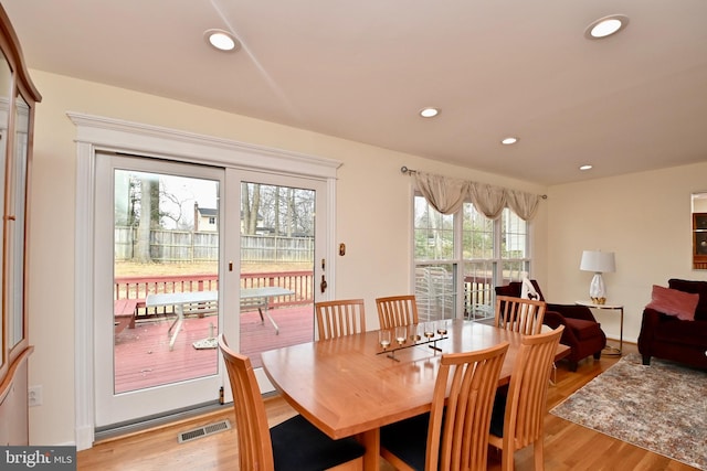 dining space featuring recessed lighting, visible vents, and light wood finished floors