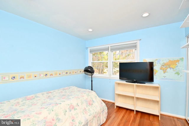 bedroom featuring recessed lighting, baseboards, and wood finished floors