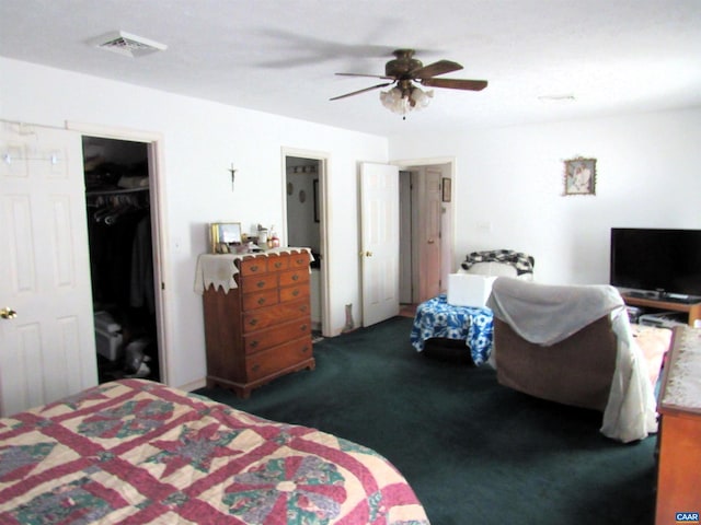 carpeted bedroom featuring ceiling fan, visible vents, and a closet