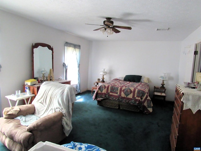 bedroom with visible vents, carpet, and ceiling fan