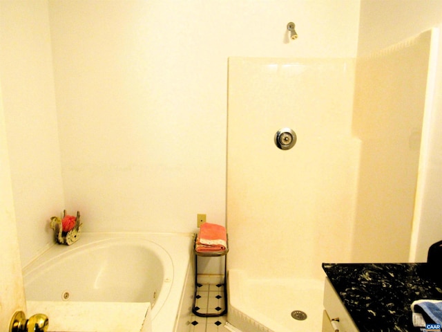 bathroom with a whirlpool tub, walk in shower, and tile patterned floors