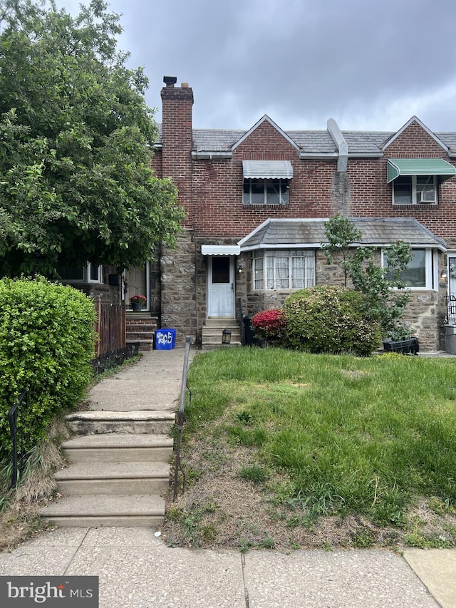 4207 Bleigh Ave, Philadelphia, PA 19136 - view of front facade featuring a chimney, stone siding, and entry steps