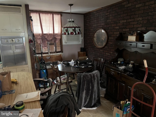 4207 Bleigh Ave, Philadelphia, PA 19136 - dining space featuring light tile patterned floors and brick wall