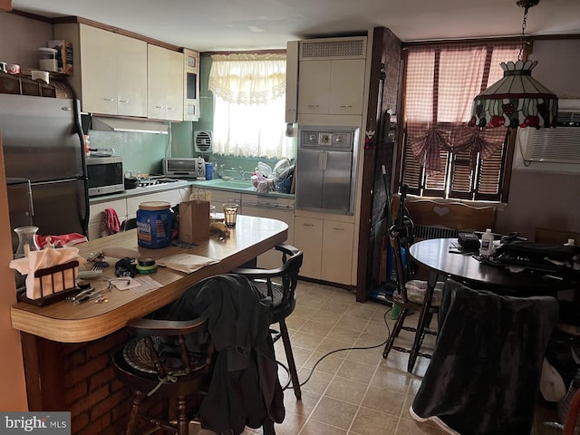 4207 Bleigh Ave, Philadelphia, PA 19136 - kitchen featuring stainless steel microwave, white cabinetry, wall oven, and a sink