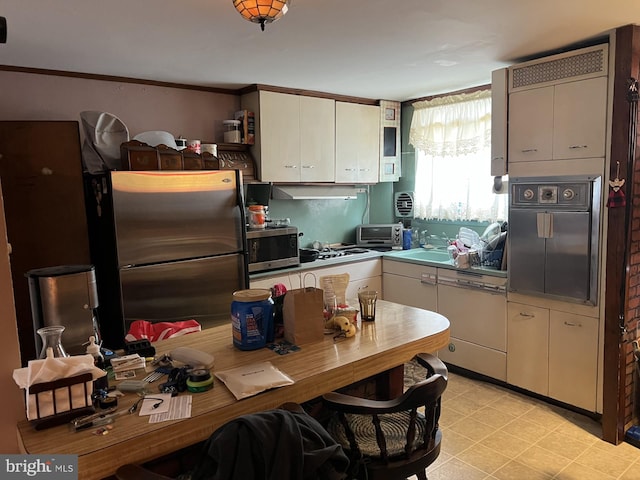 4207 Bleigh Ave, Philadelphia, PA 19136 - kitchen featuring a toaster, appliances with stainless steel finishes, white cabinets, and a sink