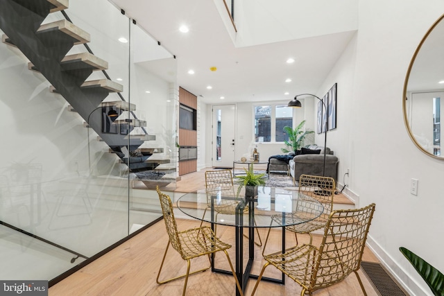 1104 N Bodine St, Philadelphia, PA 19123 - dining area with stairs, baseboards, recessed lighting, light wood-style flooring, and a skylight