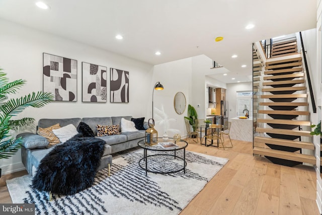 1104 N Bodine St, Philadelphia, PA 19123 - living room with recessed lighting, stairway, and light wood-style floors