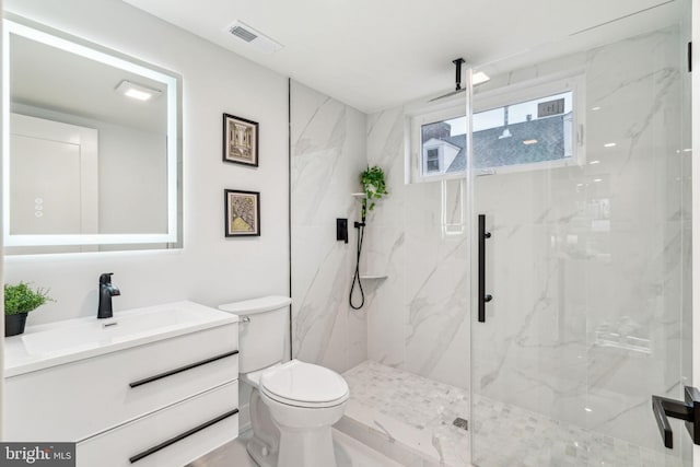 1104 N Bodine St, Philadelphia, PA 19123 - bathroom with a marble finish shower, vanity, toilet, and visible vents