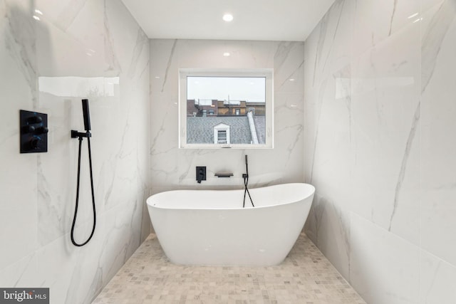 1104 N Bodine St, Philadelphia, PA 19123 - bathroom with a freestanding bath and tile walls