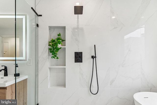 1104 N Bodine St, Philadelphia, PA 19123 - full bath with tile walls, a freestanding bath, a marble finish shower, and vanity