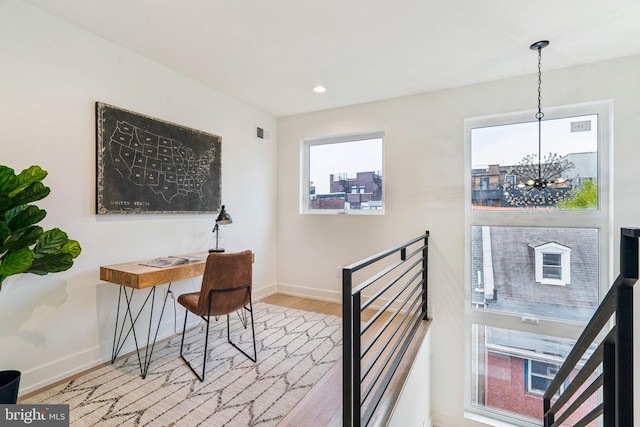 1104 N Bodine St, Philadelphia, PA 19123 - home office with visible vents, baseboards, wood finished floors, and an inviting chandelier