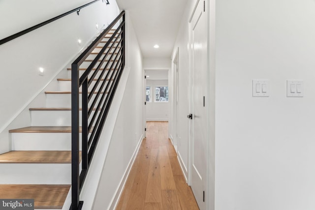 1104 N Bodine St, Philadelphia, PA 19123 - stairway featuring recessed lighting, baseboards, and hardwood / wood-style floors