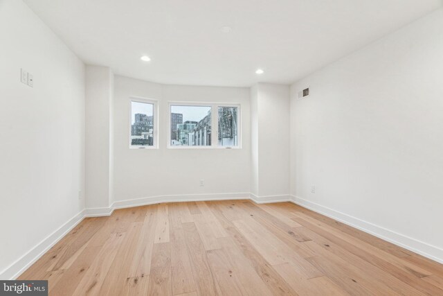 1104 N Bodine St, Philadelphia, PA 19123 - empty room with light wood-style floors, baseboards, recessed lighting, and visible vents