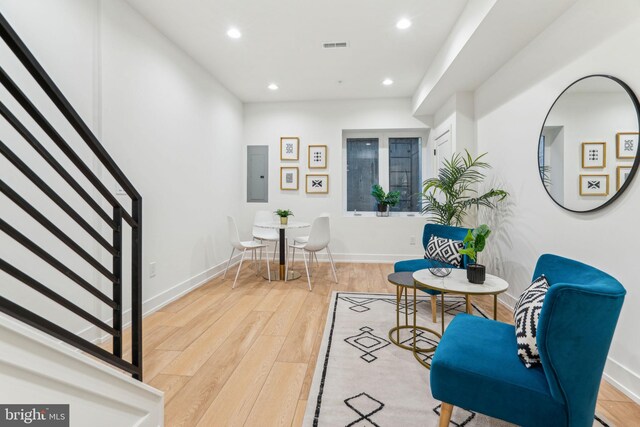 1104 N Bodine St, Philadelphia, PA 19123 - sitting room with baseboards, stairway, recessed lighting, electric panel, and light wood-style flooring