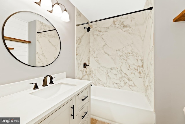 bathroom featuring  shower combination and vanity