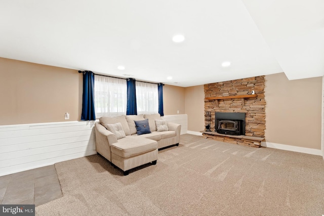 living area with baseboards, carpet, a wood stove, and recessed lighting