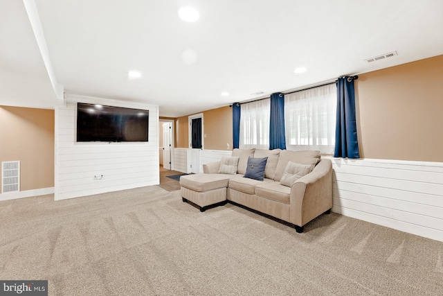 living room featuring carpet floors, recessed lighting, and visible vents