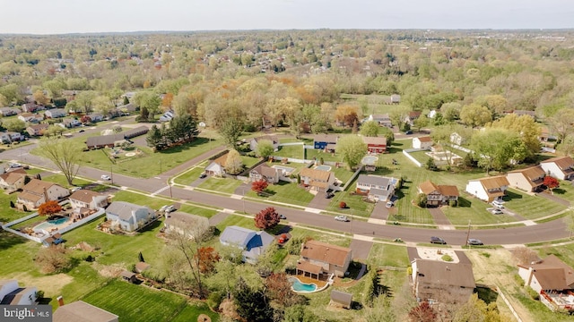 birds eye view of property with a residential view and a forest view
