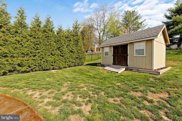 view of shed featuring fence