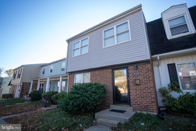 view of front of property featuring brick siding and entry steps